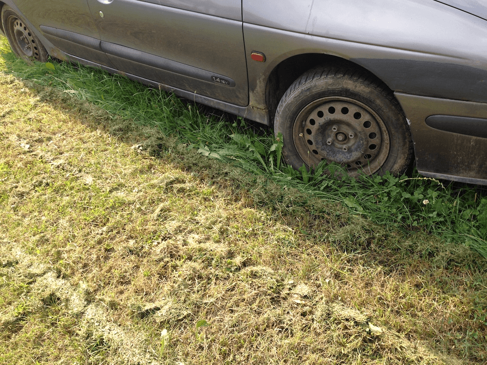 Chopping the grass around a broken and unnecessary object in the system.